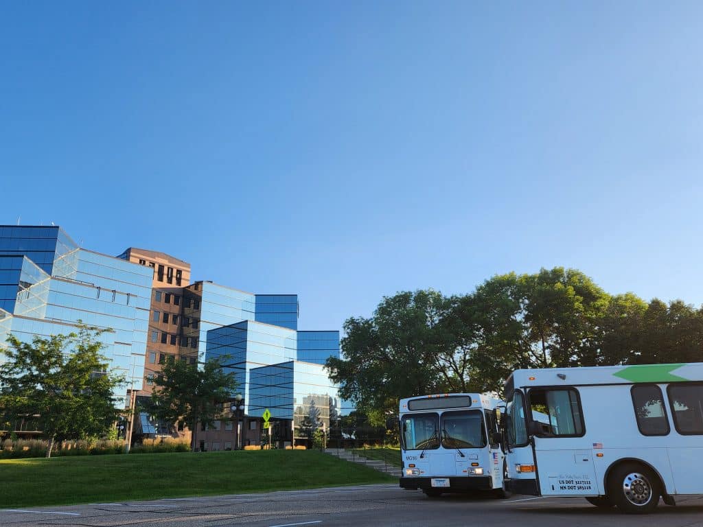 Modern buildings with buses in foreground