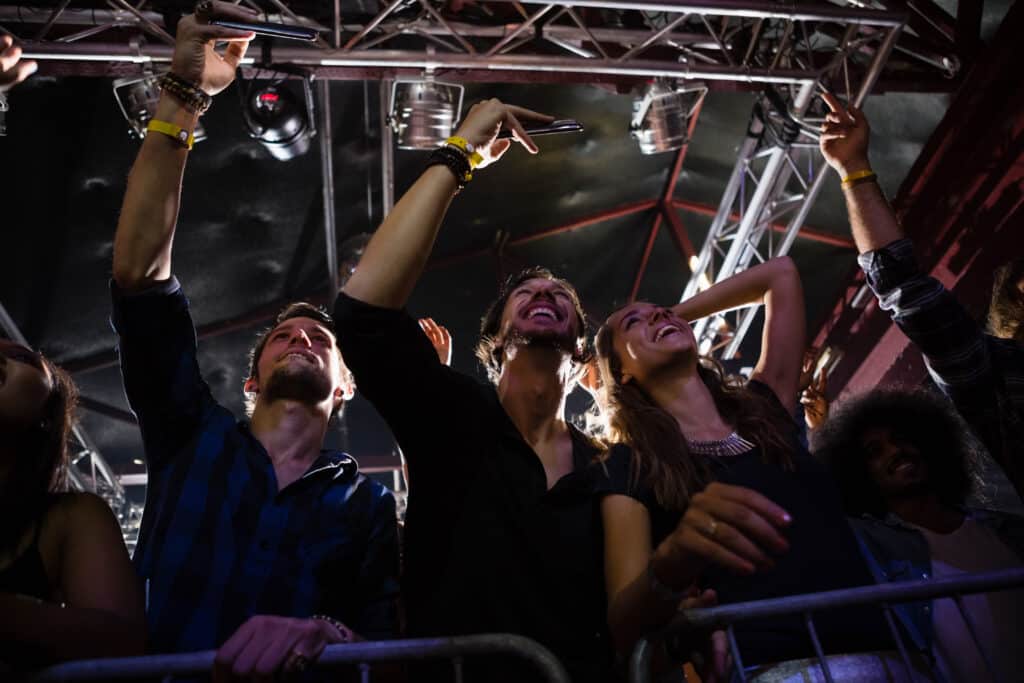Crowd enjoying live concert performance at Minneapolis venue with Elite Party Bus providing group transportation for the night