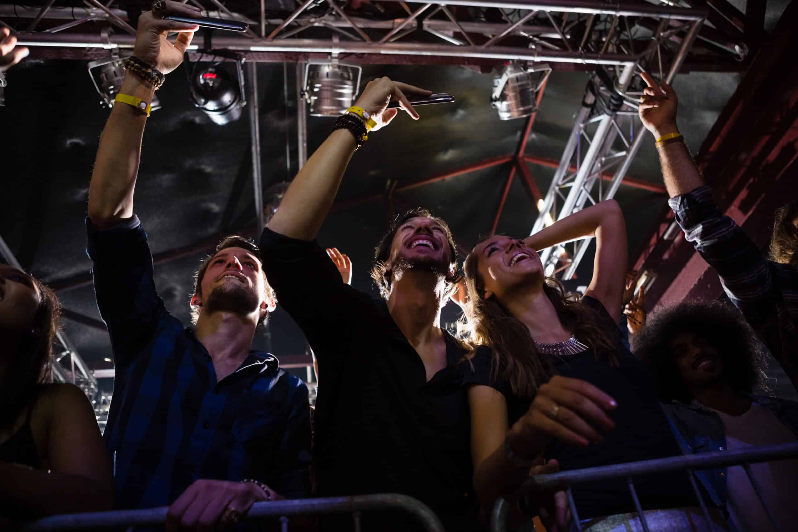 Crowd enjoying live concert performance at Minneapolis venue with Elite Party Bus providing group transportation for the night
